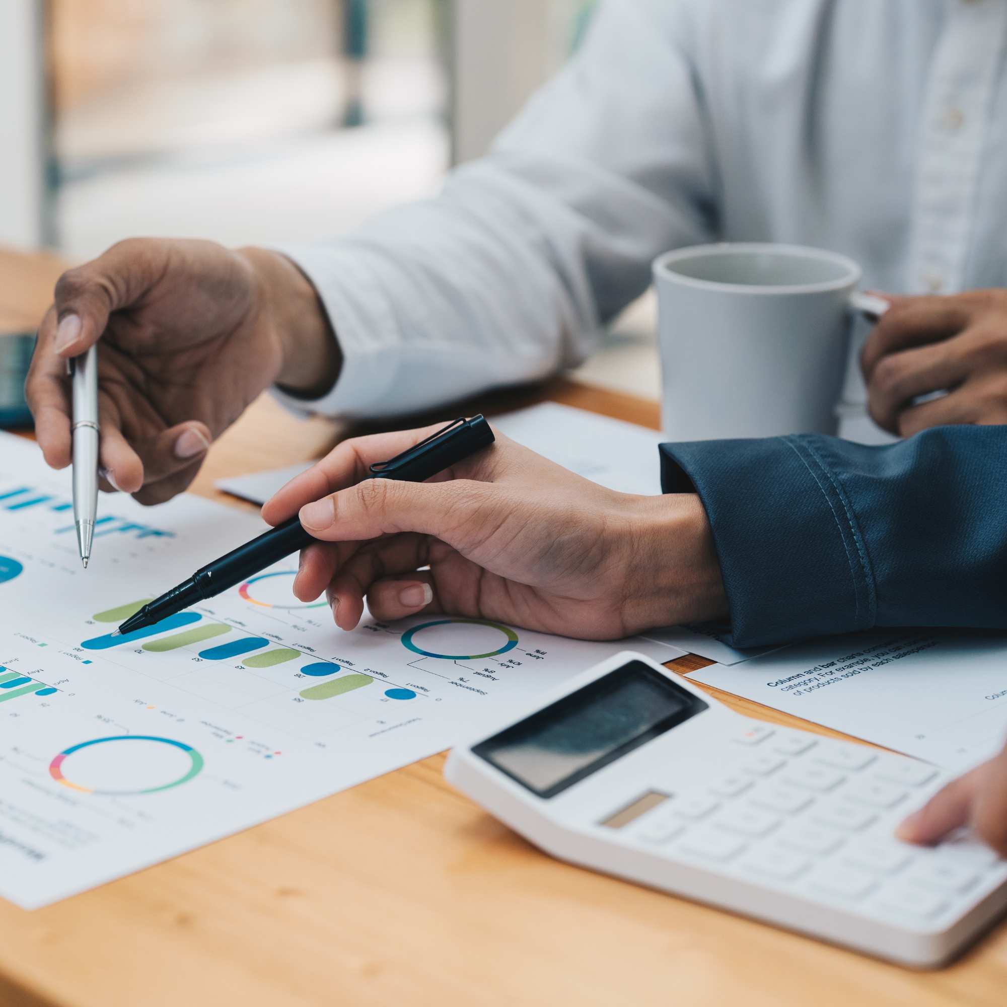 Discussing financial data with business man over coffee